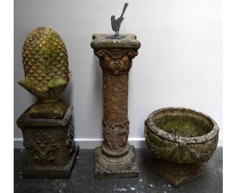 A composite sundial with metal bird on top together with composite stone planter with swag decoration, acorn and stand