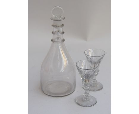 An early 20th century decanter, two cut glass sherry glasses and a water jug