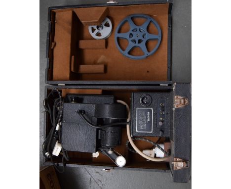 A vintage cased Kodak 8mm film projector with a large number of reels