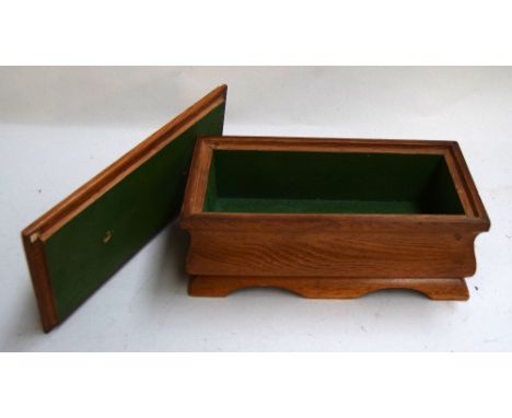 An oak tea caddy shaped box