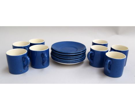 A Moorcroft powder blue part coffee set comprising 8 coffee cans and 7 saucers