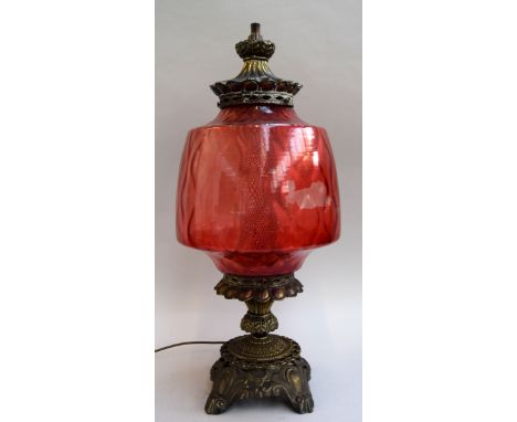 A Carl Falkenstein american table lamp with cranberry coloured glass