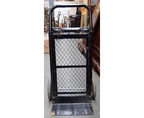 A sky watcher telescope and tripod together with a sack trolley