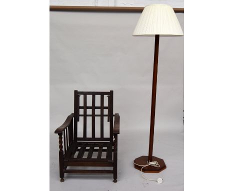 An oak folding chair with adjustable back and footrest together with a standard lamp with octagonal shaft and base with cream