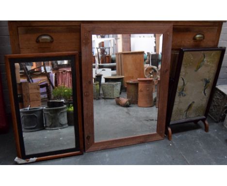Two wall mirrors each with pine frames together with a fire screen of embroidered silk of birds of paradise