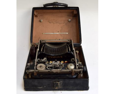 An early 20th century Corona 3 typewriter  in leather case together with an Ofrex bakelite ribbon box containing a spare ribb