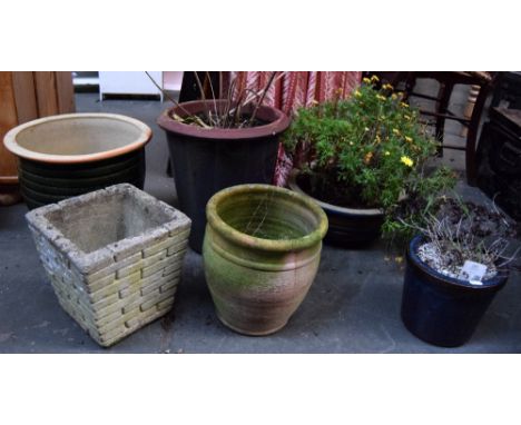 A large green ceramic planter together with a terracotta planter, a square composite planter together with a tall blue cerami