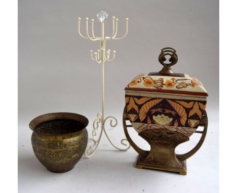 An art noveau style ceramic container with brass supports and floral decoration together with an islamic brass bowl and a met