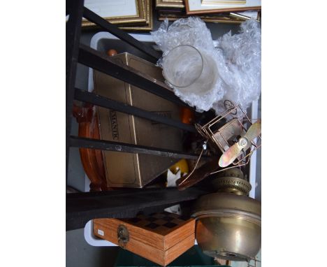 A mixed lot to include: an ebonised plate rack, a gas lamp with two chimneys, a metal model of a biplane, a boxed chess set a