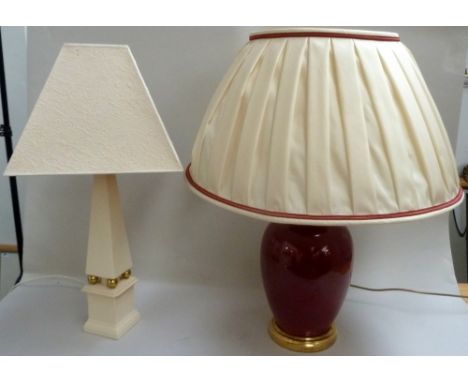 A Valsan lamp of obelisk form with shade together with a red ceramic lamp with shade