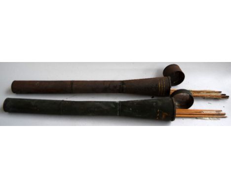 Military interest: A pair of green painted metal canisters used as arrow quivers, one painted with the crest of the Royal War