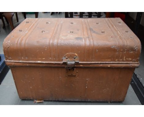 A large brown painted metal trunk with side handles