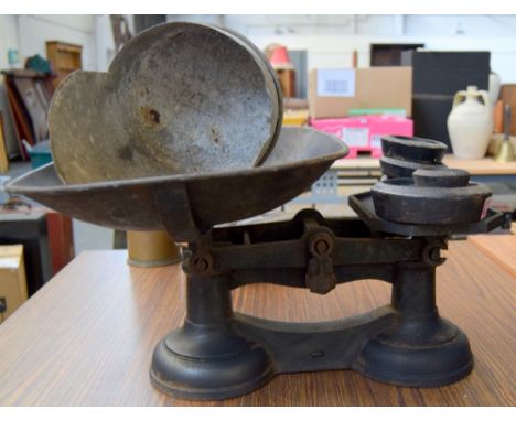 A vintage set of flour scales with weights made by the Crane Foundry Wolverhampton together with a galvanised metal feed scoo