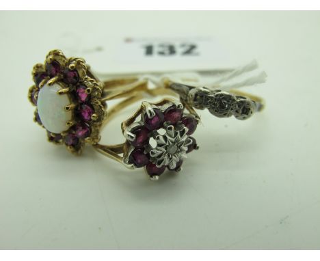 A 9ct Gold Opal and Garnet Cluster Dress Ring, oval claw set to the centre, (finger size L); together with a further 9ct gold