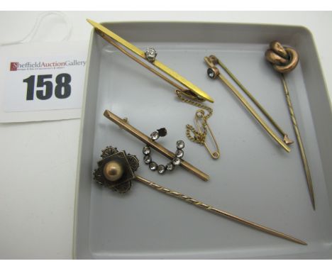 A Single Stone Diamond Set Bar Brooch, claw set on plain bar, together with two stick pins, a further bar brooch, etc.