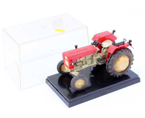 An unusual 'Made in Poland' approximately 1/16 scale Ursus C335 plastic tractor comprising red and white body with cream hubs