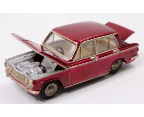 Asahi Toys ATC (Model Pet) 1/42nd scale No. 30 Mazda Familia comprising a metallic red body, with an white interior, and glos