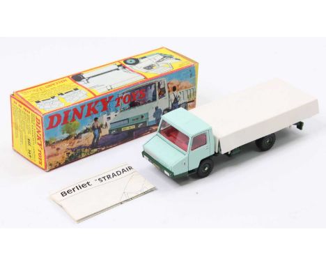 French Dinky Toys No. 569 Berliet Open Back Tipper Truck comprising a turquoise cab and back, dark green chassis and hubs, wi