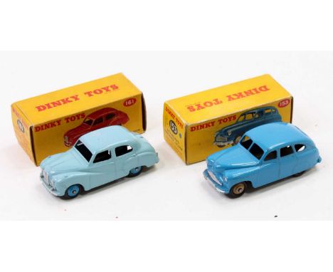 Dinky Toys boxed model group of 2 comprising No. 153 Standard Vanguard Saloon, blue body with tan hubs, housed in the origina