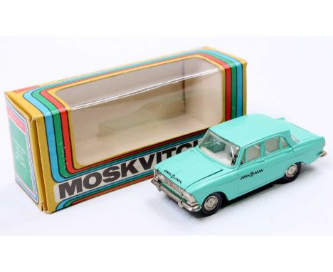 A boxed Russian Diecast 1/43rd scale model of a Moskvitch Taxi in sea green, with a white interior, and detailed hubs (VNM-BN