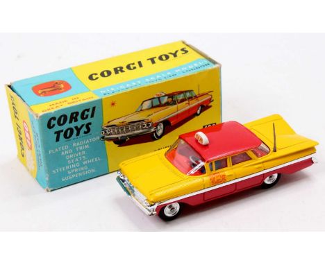 Corgi Toys No. 480 Chevrolet Taxi Cab comprising of red and yellow body with white taxi roof sign, complete with driver and s