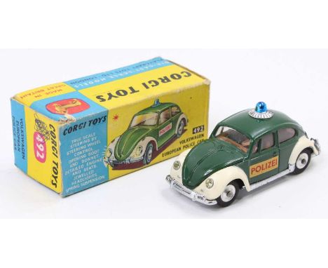 Corgi Toys No. 492 Volkswagen European police car comprising of dark green and white body with blue roof light and two passen