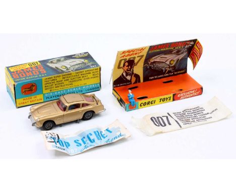 Corgi Toys No. 261 James Bond Aston Martin DB5 comprising of gold body with red interior, working mechanisms and cast wire wo