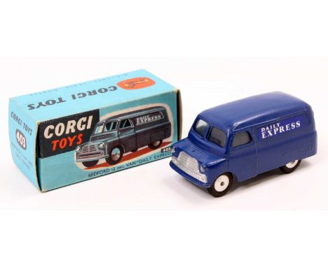 Corgi Toys No. 403 Bedford 12 cwt Daily Express delivery van comprising of a dark blue body with flat spun hubs, and Daily Ex