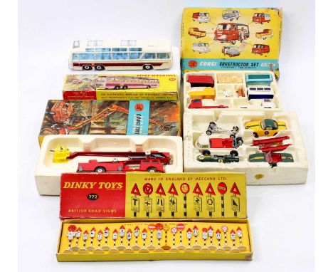 A collection of playworn and boxed Corgi and Dinky toys to include a Corgi Toys gift set No. 24 Constructors set, a No. 1127 