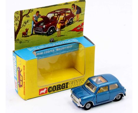 A Corgi No. 334 Mini Cooper Magnifique comprising of metallic blue body with tan interior and cast hubs, housed in the origin