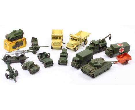 A collection of Dinky Toys military vehicles, with examples including a boxed No. 676 Armoured Personnel Carrier, No. 661 Sca