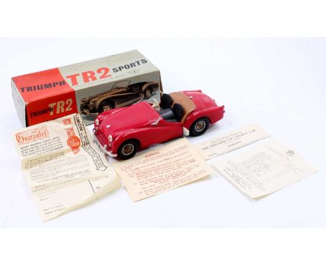 Victory Industries 1/18th scale plastic model of a Triumph TR2 Sports Car, red body, with black seats, missing windscreen, ho