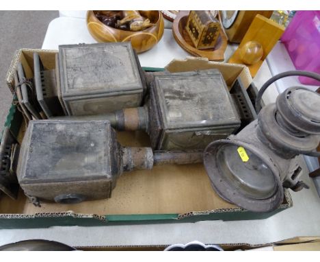Three vintage coaching lamps and a Powell & Hanmer Ltd carbide style lamp