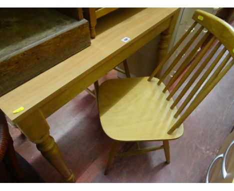 Light wood table and three light wood stick back chairs