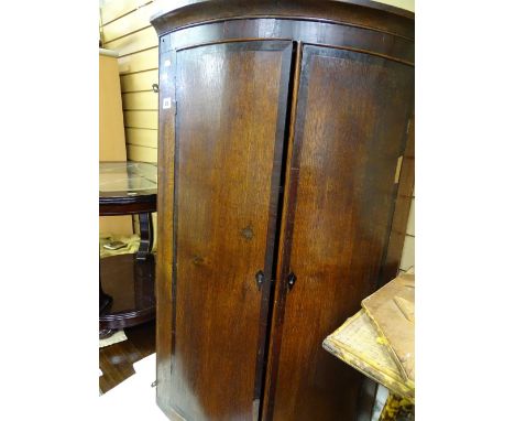 Two door corner cabinet with interior shelf