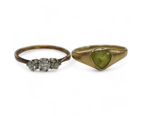 An 18ct and three stone diamond set ring, size G and one other 9ct gold and heart shaped green stone set ring. Condition - po
