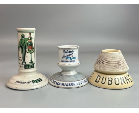 A vintage french ceramic 'Pippermint Get' straw holder with two ceramic advertising match strikers including Dubonnet and Abs