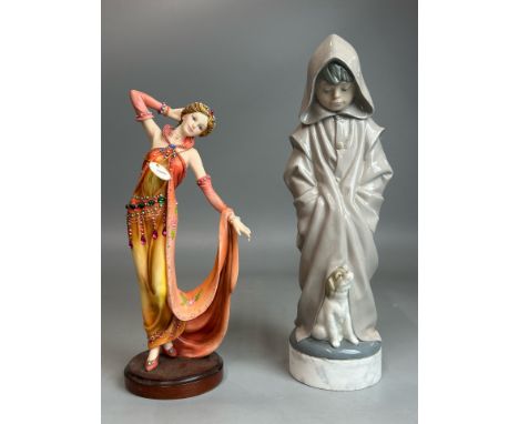 A NAO figure "Boy with Hood and Puppy" no. 0354, 29cm high (including attached marble base) and a Regency Fine Arts figurine 