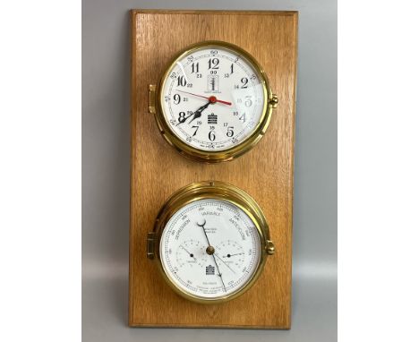 Mounted brass S.E. Wills clock and barometer, both 16cm diameter, mount 25 x 48cm / AN19
