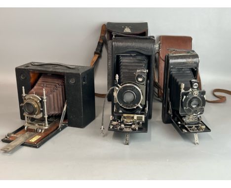 Three Vintage Kodak folding cameras including no. 3A Autographic Kodak Special model B, no.1A series III and an early Kodak c