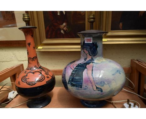 Two French pottery table lamps, largest excluding fitting 36cm.   Condition Report:  Good overall.  Loss of paint (black) to 