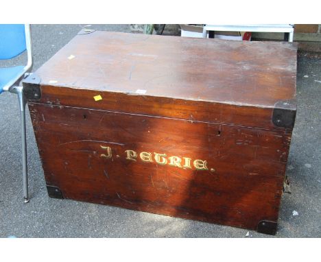 A late 19th/early 20th century stained pine and metal bound trunk, the front inscribed 'J Petrie', 92cm wide.  
