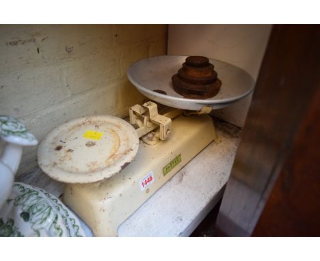 A set of green painted Harper kitchen scales. 