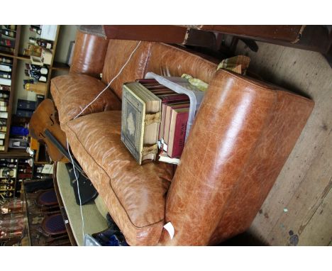 A large tan leather two seater sofa, approx 230cm wide.