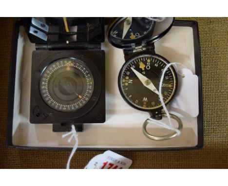 Two folding pocket compasses, one inscribed 'Busch, 52693, DRGM'; the other inscribed 'TG Co Ltd, Compass Magnetic Marching, 