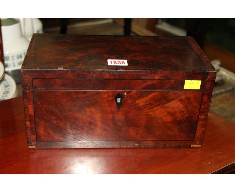 A George III mahogany and crossbanded tea caddy, 30.5cm wide. 