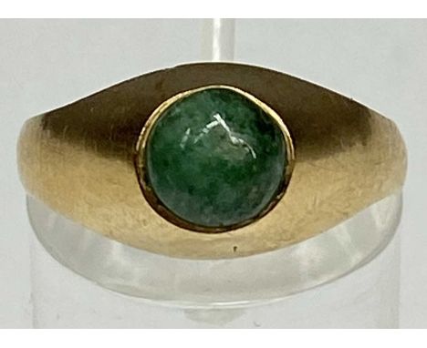 CONTEMPORARY YELLOW GOLD RING set with green cabochon stone, size P, 4gmsProvenance: private collection Ynys Môn
