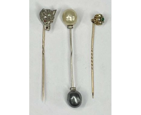 WHITE & YELLOW METAL STICK PIN modelled as a fox mask, set with old cut diamonds and ruby eyes, yellow metal stick pin, and a