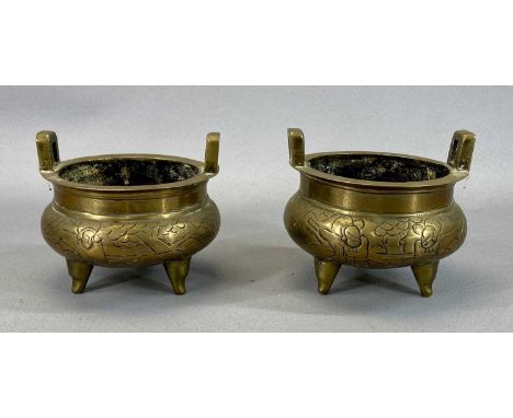 PAIR OF CHINESE BRONZE CENSERS, 19th century with side handles, engraved bodies, standing on three feet, seal marks to bases,