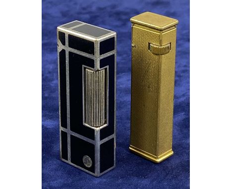 TWO VINTAGE DUNHILL CIGARETTE LIGHTERS, gold plated with engine turned decoration / white metal and black enamelProvenance: p